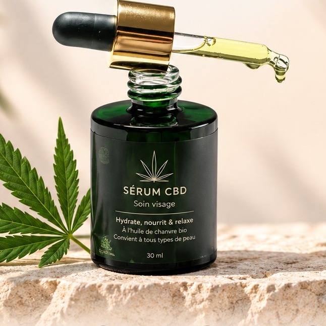 Flacon de sérum visage CBD BuddySens, 30 ml, pipette posée en travers, sur une pierre de travertin